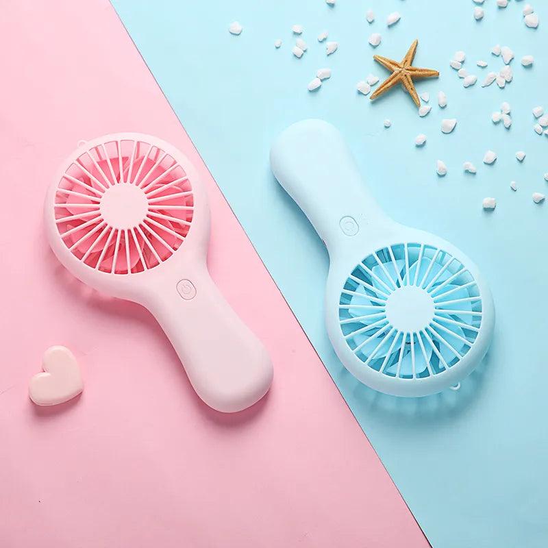 Mini Handheld Small Fan: Portable Cooling Companion with Quiet Operation  ourlum.com   