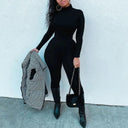 Sleek Black Turtleneck Jumpsuit Chic Winter Bodysuit Style