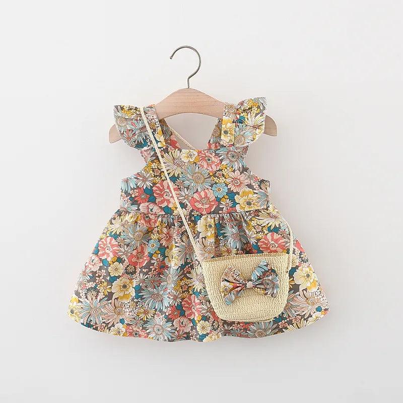 Enchanting Vintage Garden Baby Girl's Dress with Floral Accents and Matching Straw Bag  ourlum.com   