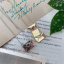 A Copper Envelope Necklace Inlaid With Red Hearts Design